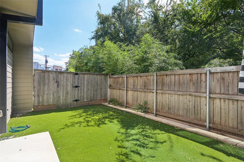 4511 Arberry Lane Dallas, TX 75219 - Photo 28 of 40 Another backyard view showing privacy and greenery.