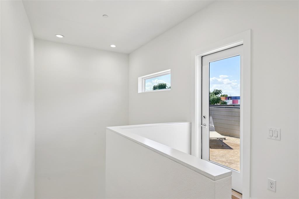 4511 Arberry Lane Dallas, TX 75219 - Photo 29 of 40 Bright stairwell leading to the rooftop deck.