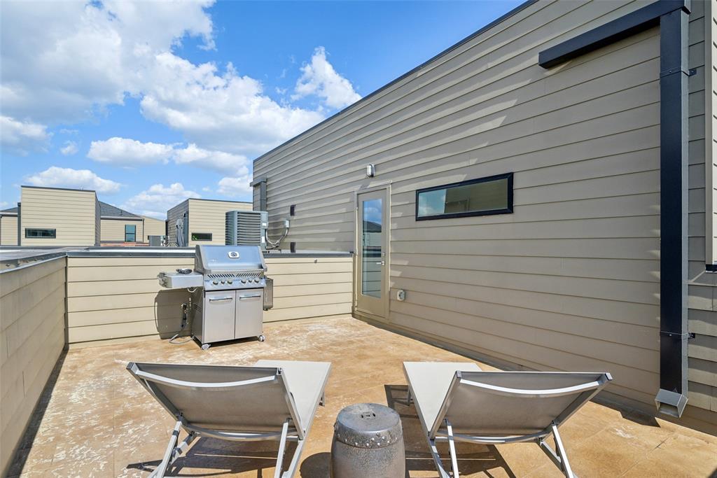 4511 Arberry Lane Dallas, TX 75219 - Photo 31 of 40 Expansive rooftop deck with space for grilling, lounging, and posting.