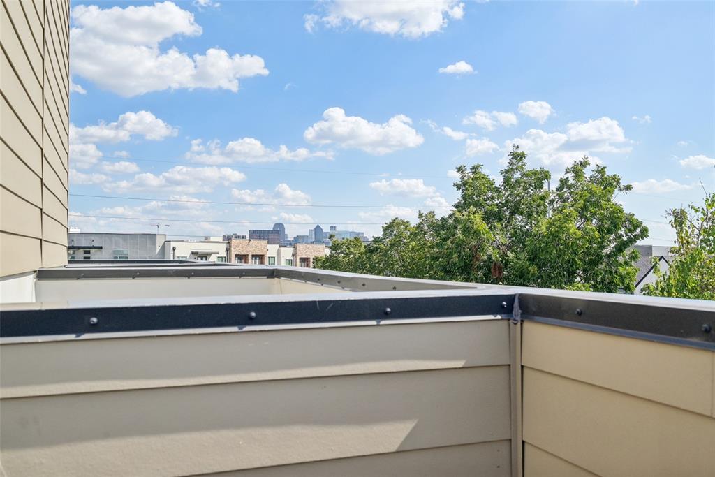 4511 Arberry Lane Dallas, TX 75219 - Photo 32 of 40 Downtown views from the rooftop — a total brag-worthy backdrop.