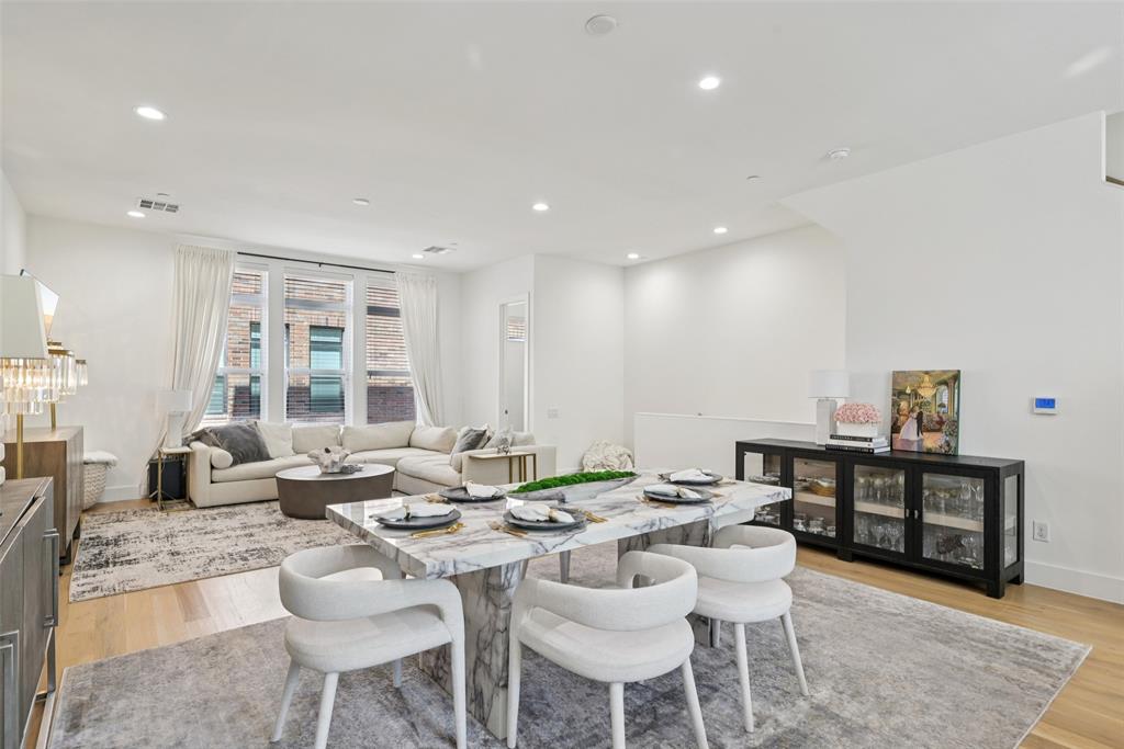 4511 Arberry Lane Dallas, TX 75219 - Photo 6 of 40 Open sightlines from dining to living highlight the expansive width.