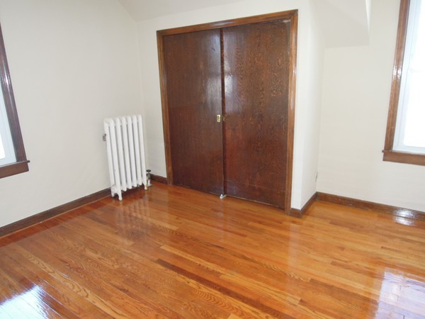54 Chilson Street Springfield, MA 01118 - Photo 12 of 19 a view of empty room with wooden floor and fan