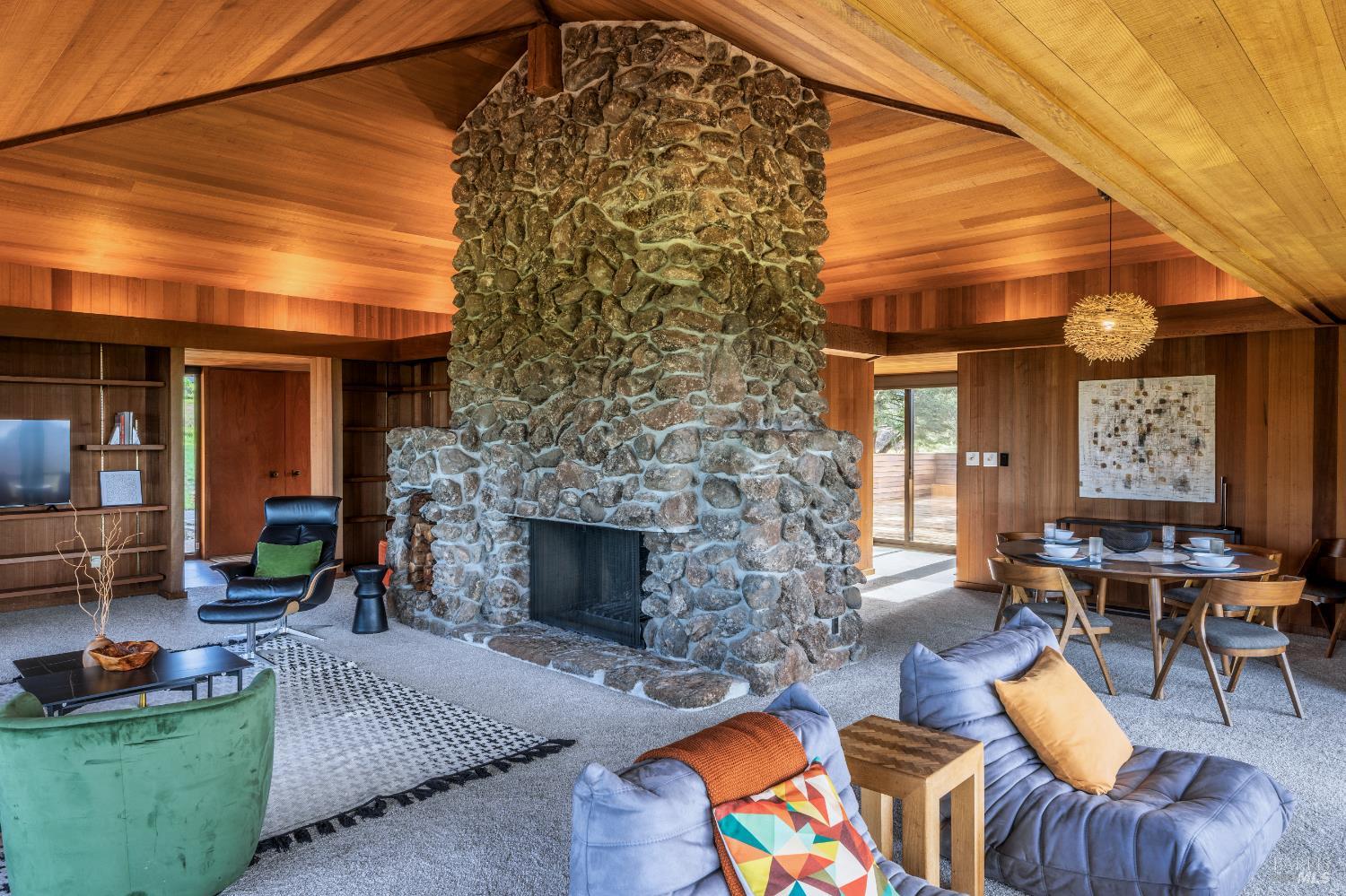 326 Conifer Close The Sea Ranch, CA 95497 - Photo 6 of 26 The heart of the house is this impressive stone fireplace.