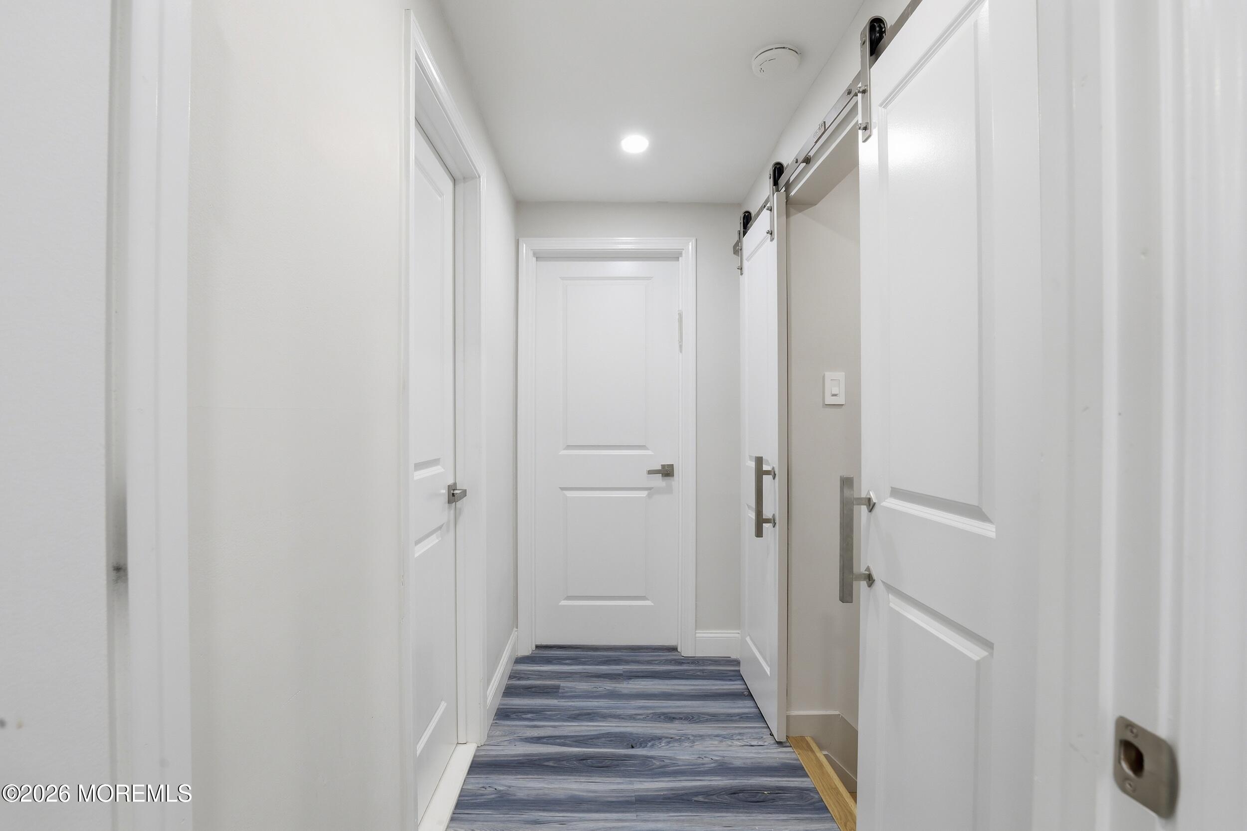 492 Cobain Road Jackson, NJ 08527 - Photo 29 of 47 a view of a hallway with wooden floor and staircase