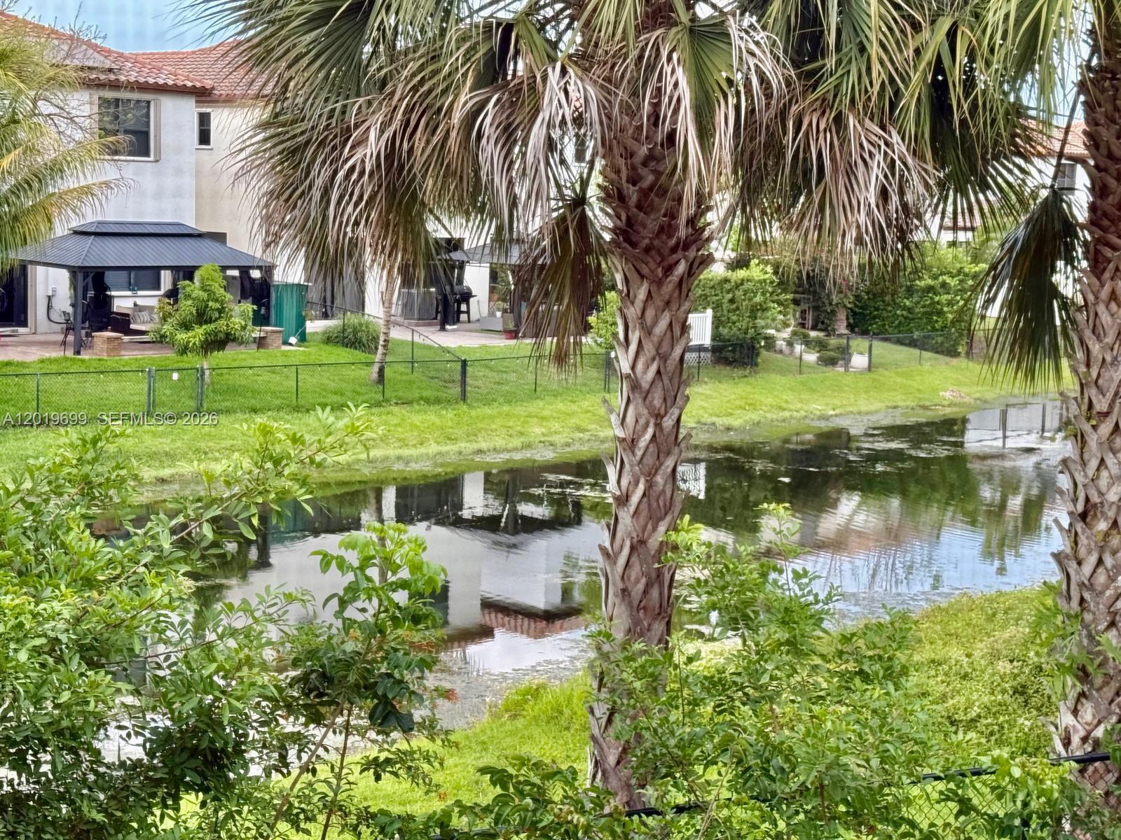 3470 Foxcroft Road, Unit 204 Miramar, FL 33025 - Photo 28 of 40 a view of a garden with a tree