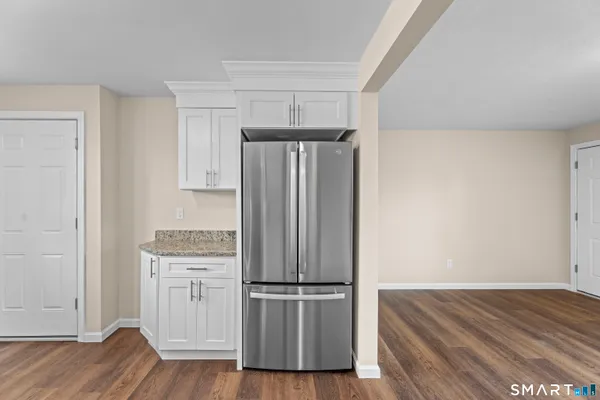 a view of kitchen with wooden floor