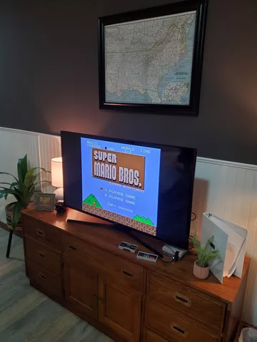 a room with wooden floor and cabinet