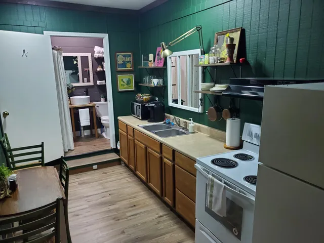 a kitchen with a stove and a refrigerator