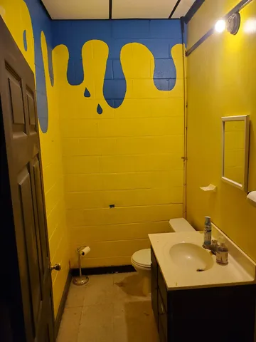 a room with furniture and a flat screen tv