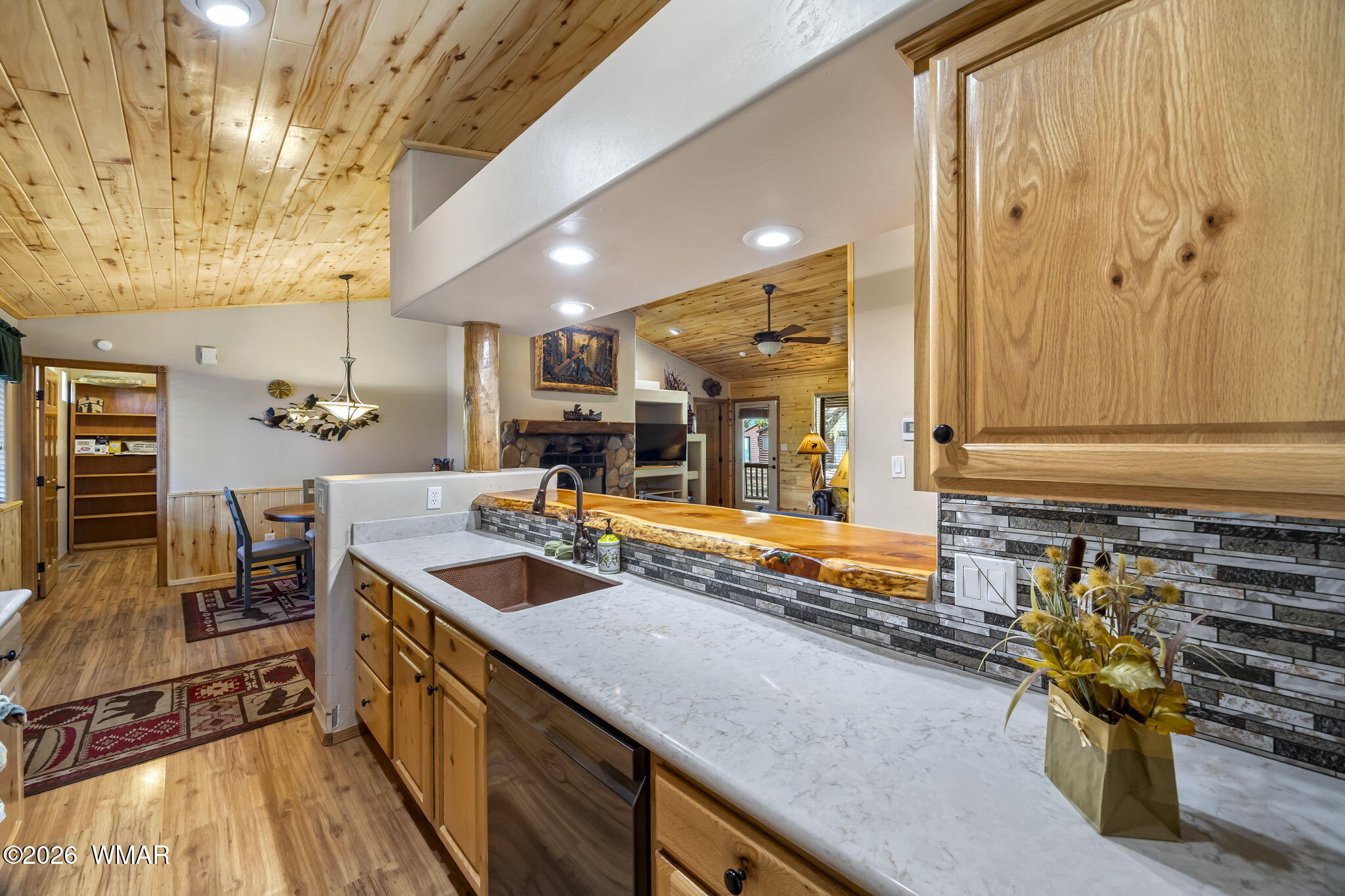 2337 Buffalo Loop Overgaard, AZ 85933 - Photo 13 of 43 a kitchen with counter top space and wooden floor