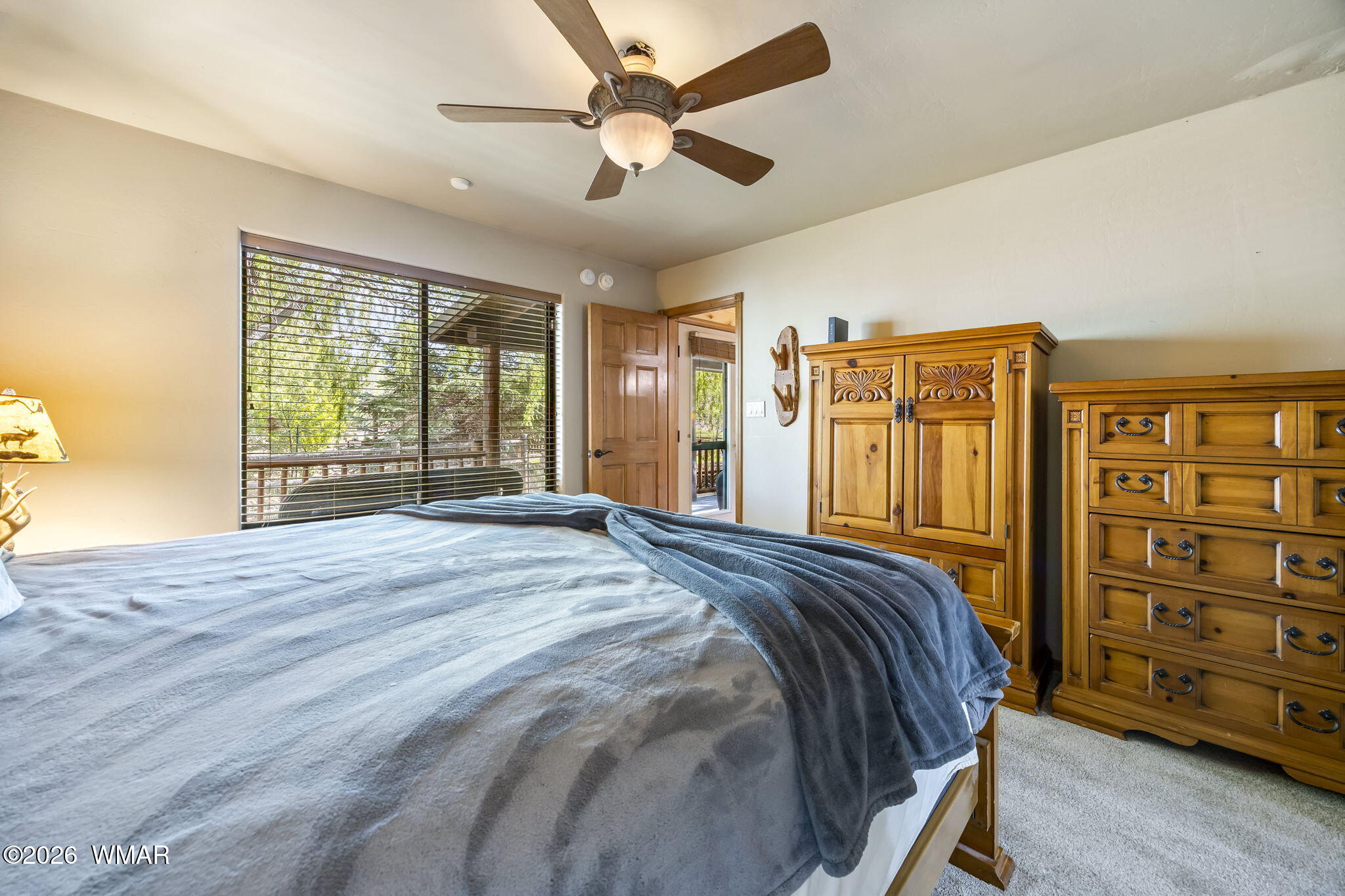 2337 Buffalo Loop Overgaard, AZ 85933 - Photo 15 of 43 a bed sitting in a spacious bedroom next to a window