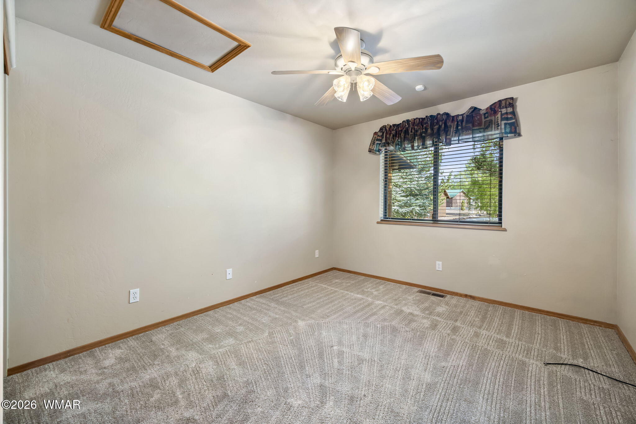 2337 Buffalo Loop Overgaard, AZ 85933 - Photo 17 of 43 an empty room with windows