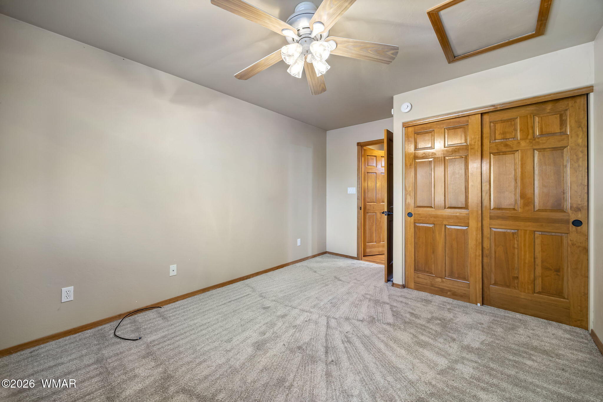 2337 Buffalo Loop Overgaard, AZ 85933 - Photo 18 of 43 wooden floor in an empty room with a window