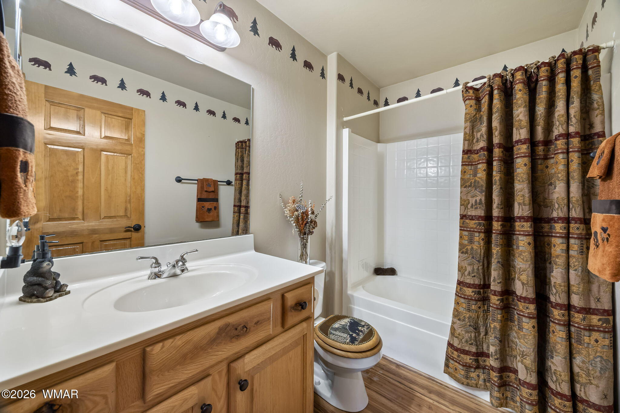 2337 Buffalo Loop Overgaard, AZ 85933 - Photo 19 of 43 a bathroom with a sink toilet a mirror and shower