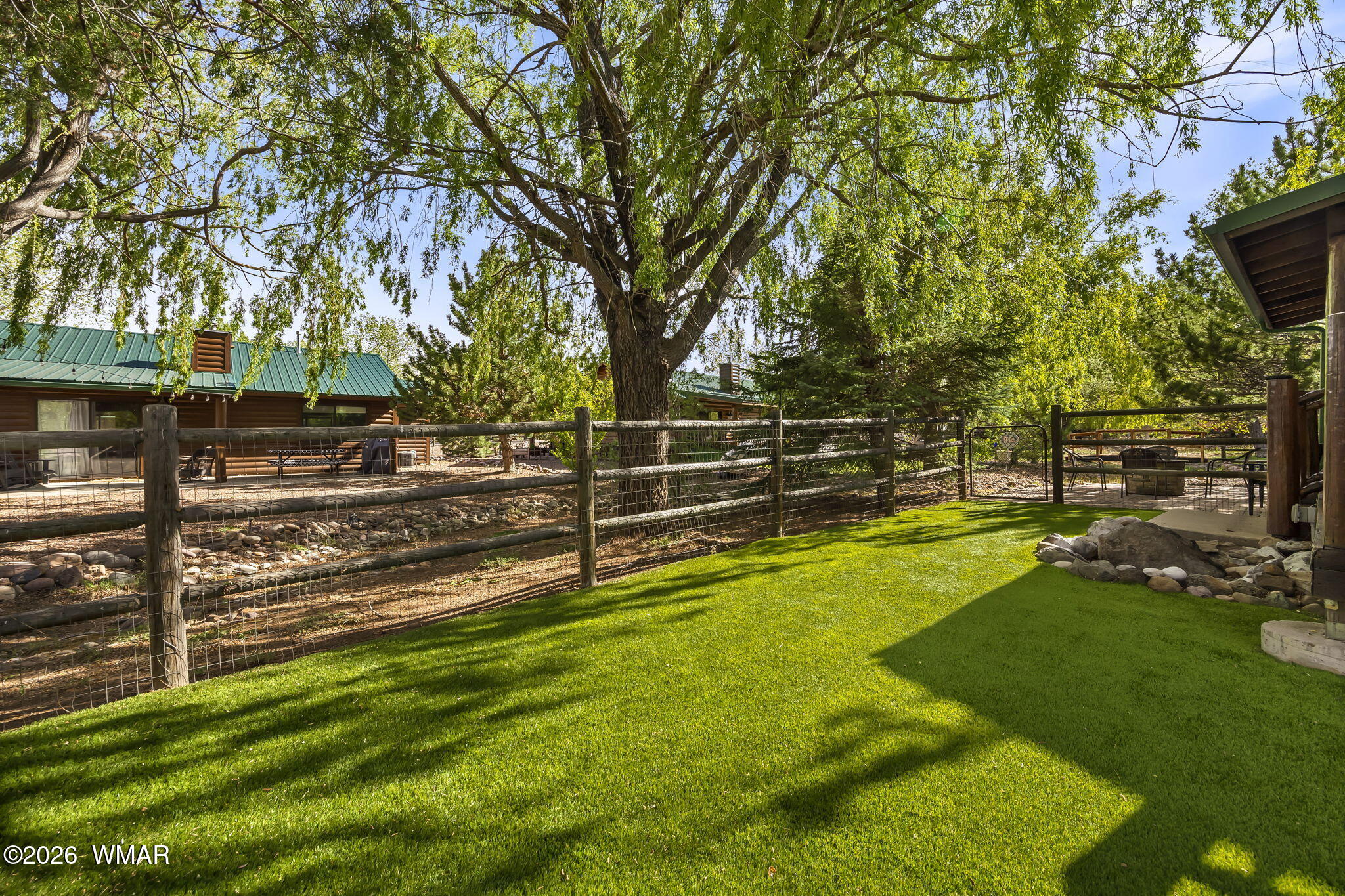2337 Buffalo Loop Overgaard, AZ 85933 - Photo 27 of 43 a view of a yard with wooden fence