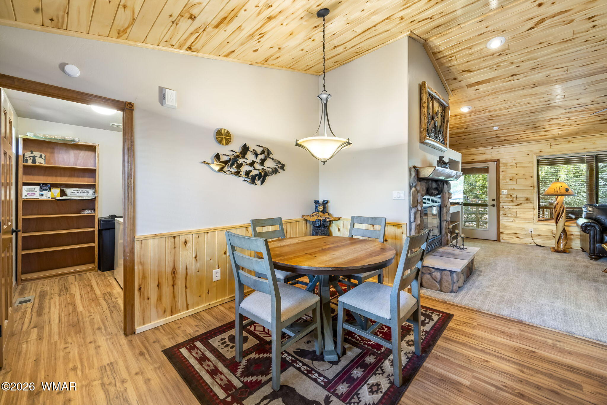 2337 Buffalo Loop Overgaard, AZ 85933 - Photo 4 of 43 a view of a dining room with furniture and wooden floor