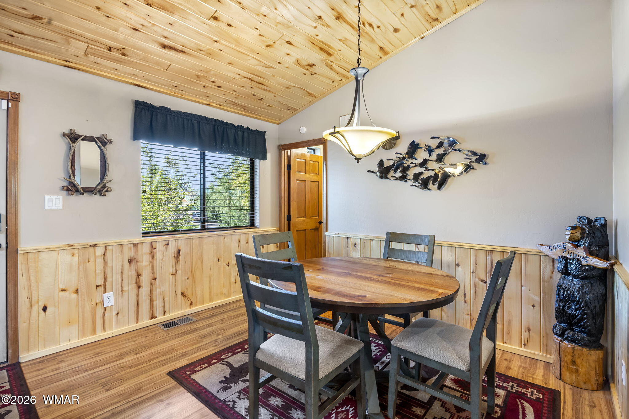 2337 Buffalo Loop Overgaard, AZ 85933 - Photo 10 of 43 a view of a dining room with furniture window and wooden floor