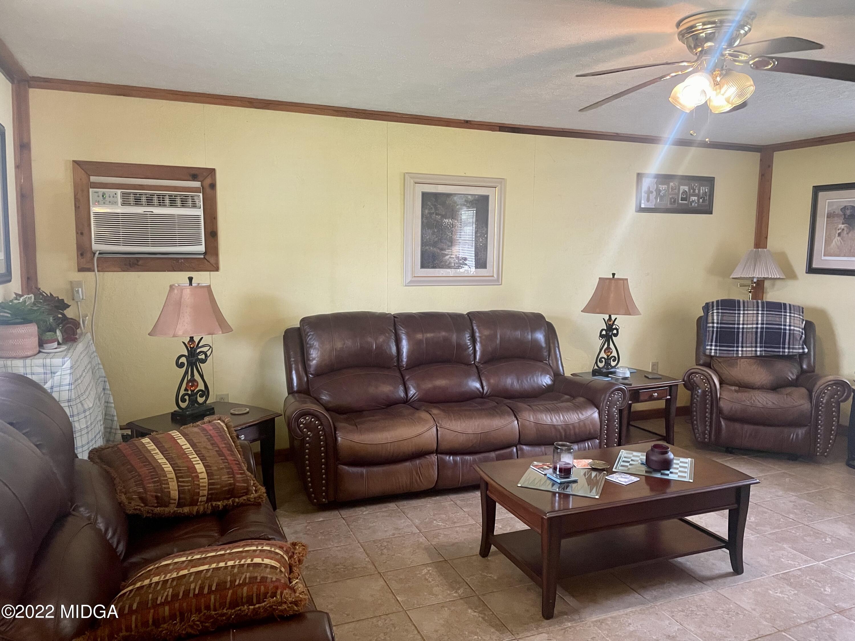 62 McMullen Road Forsyth, GA 31029 - Photo 4 of 10 a living room with furniture