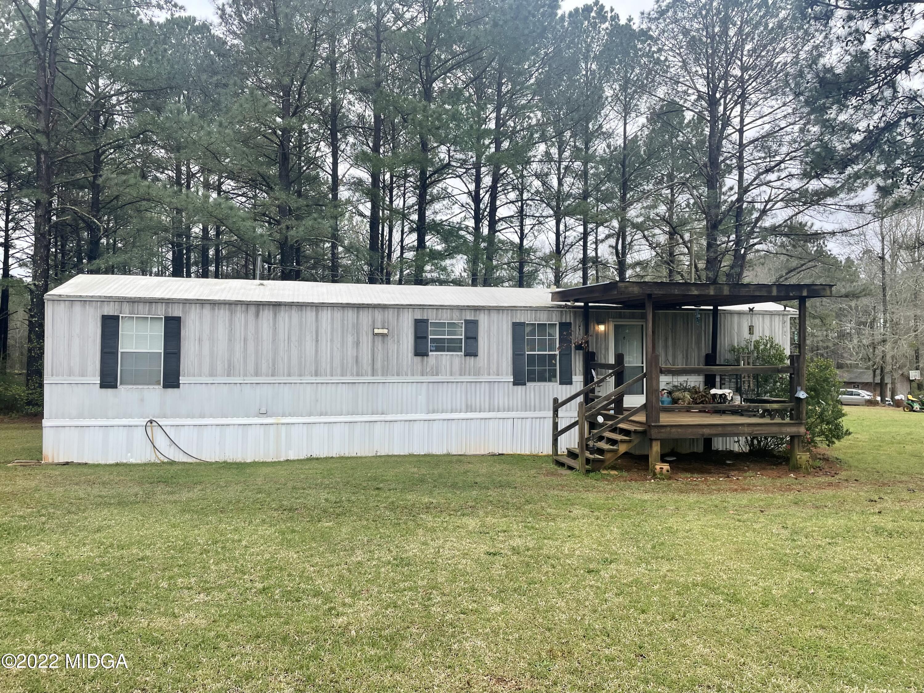 62 McMullen Road Forsyth, GA 31029 - Photo 10 of 10 a view of house with backyard and tub