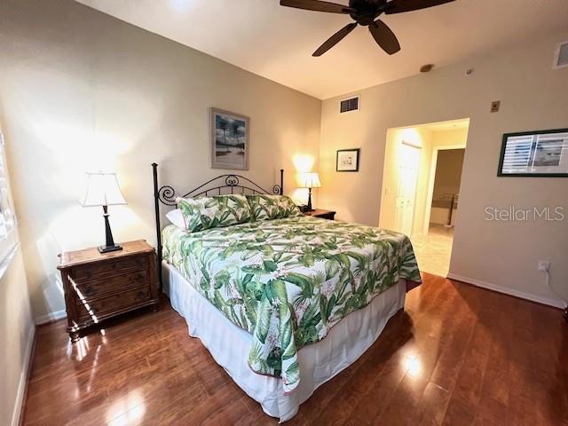 2060 Matecumbe Key Road, Unit 2301 Punta Gorda, FL 33955 - Photo 11 of 41 a bed sitting in a bedroom next to a lamp