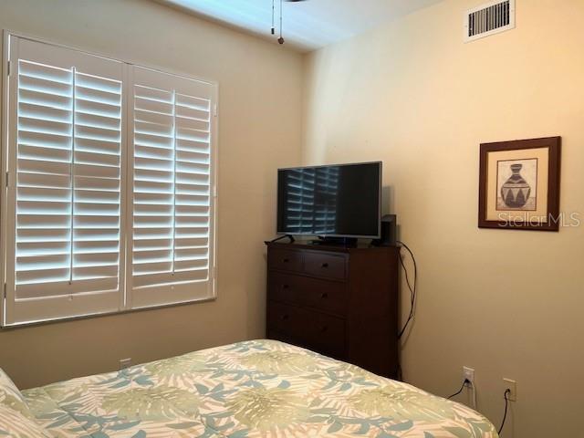 2060 Matecumbe Key Road, Unit 2301 Punta Gorda, FL 33955 - Photo 18 of 41 a bedroom with a bed and a television