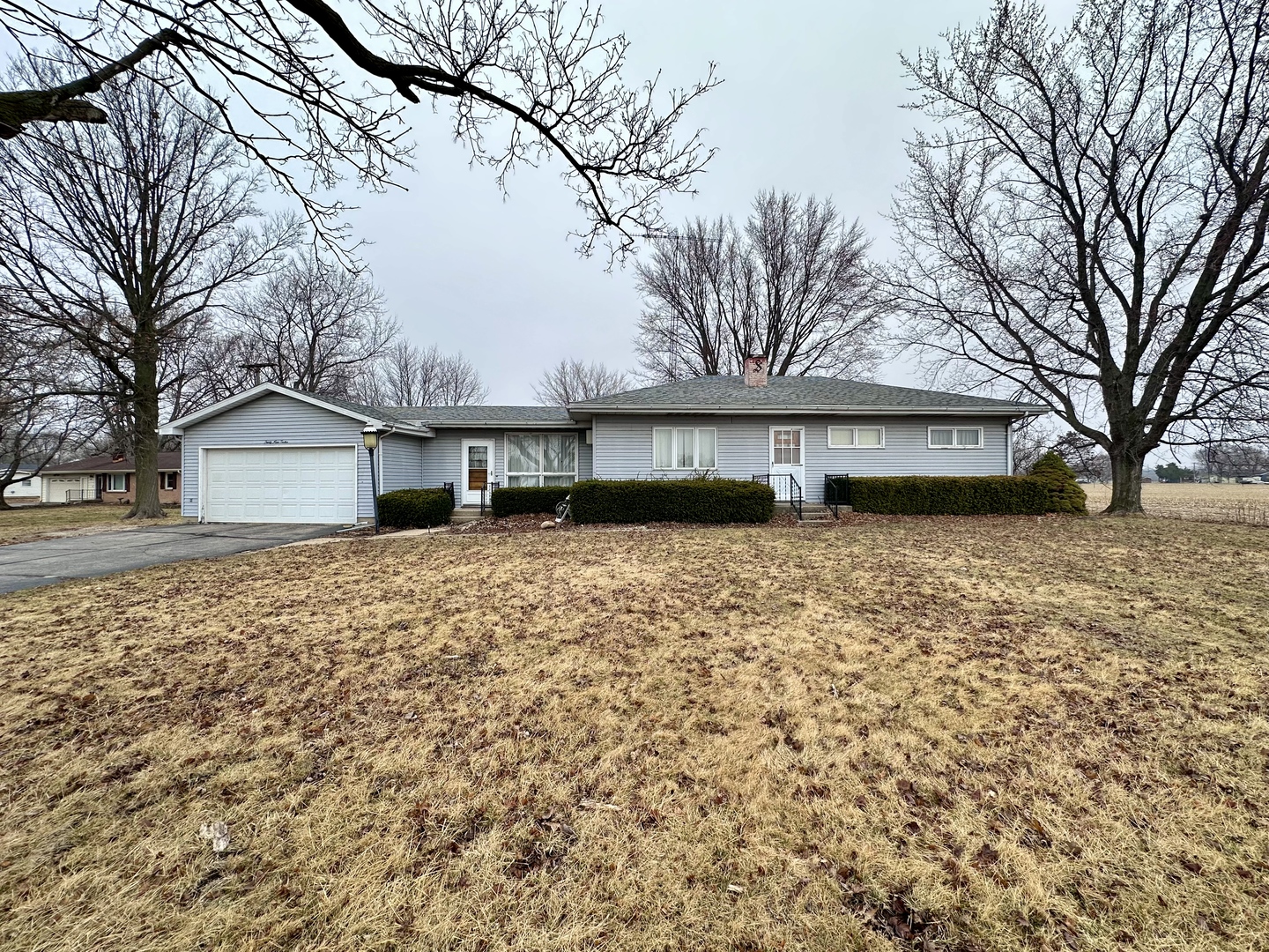 3912 Emerson Road Sterling, IL 61081 - Photo 1 of 22 a front view of a house with a yard