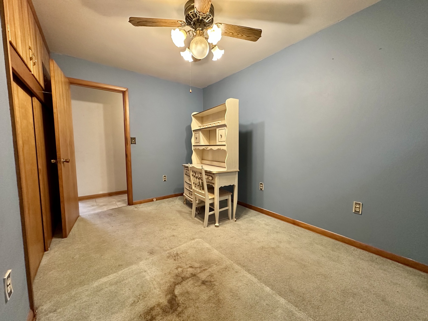 3912 Emerson Road Sterling, IL 61081 - Photo 13 of 22 an empty room with chandelier fan and windows