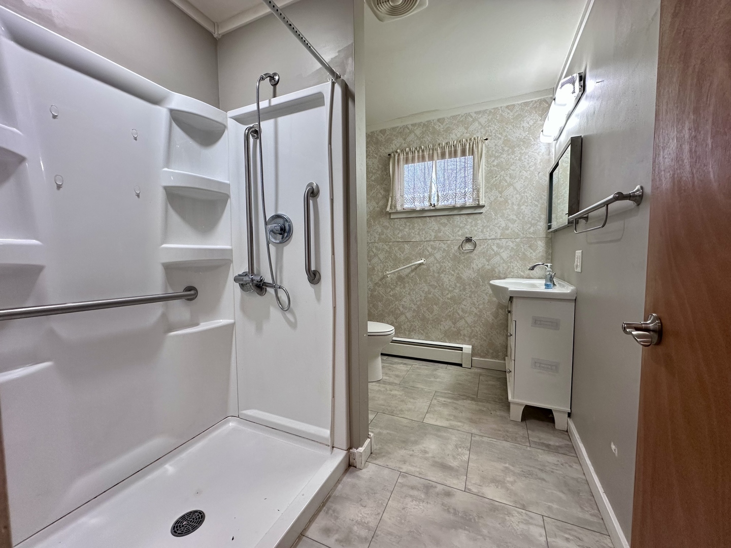 3912 Emerson Road Sterling, IL 61081 - Photo 14 of 22 a bathroom with a shower and a sink