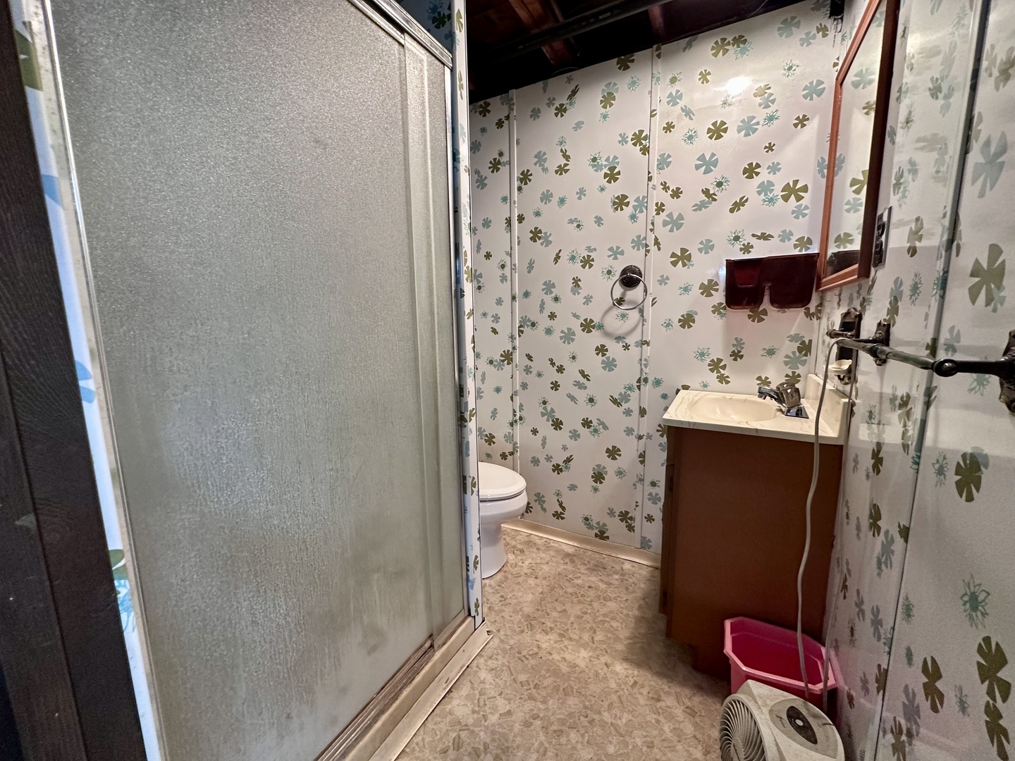 3912 Emerson Road Sterling, IL 61081 - Photo 18 of 22 a bathroom with a toilet and a shower curtain