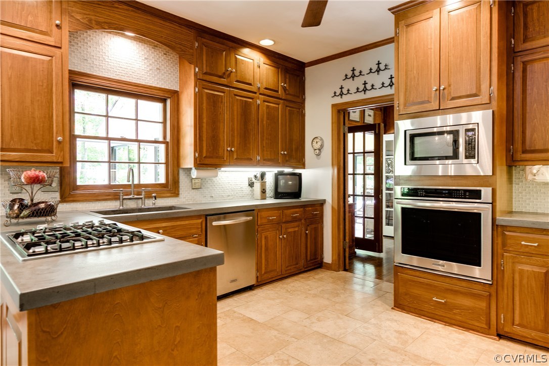 9800 Kingsbridge Road Henrico, VA 23238 - Photo 12 of 50 Kitchen with concrete countertops and travertine f