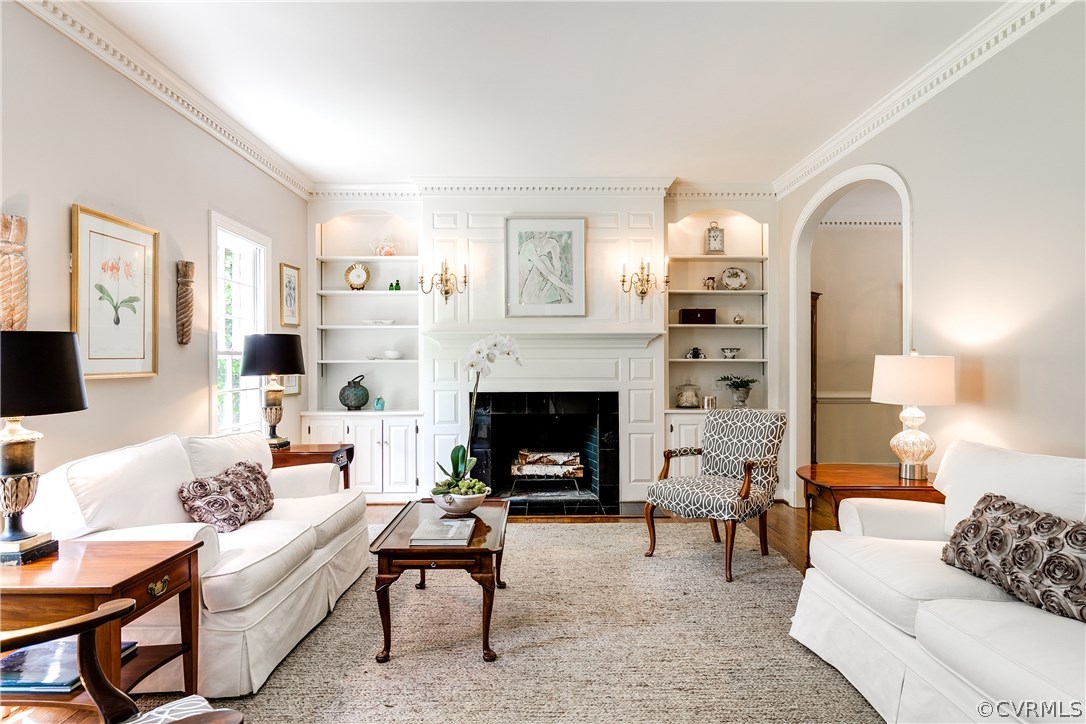 Living Room with arched entryway to Dining Room