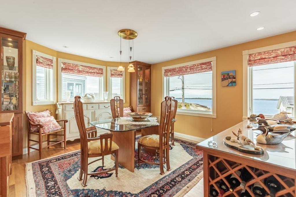 79 Clark Road Ipswich, MA 01938 - Photo 15 of 35 a view of a dining room with furniture window and outside view