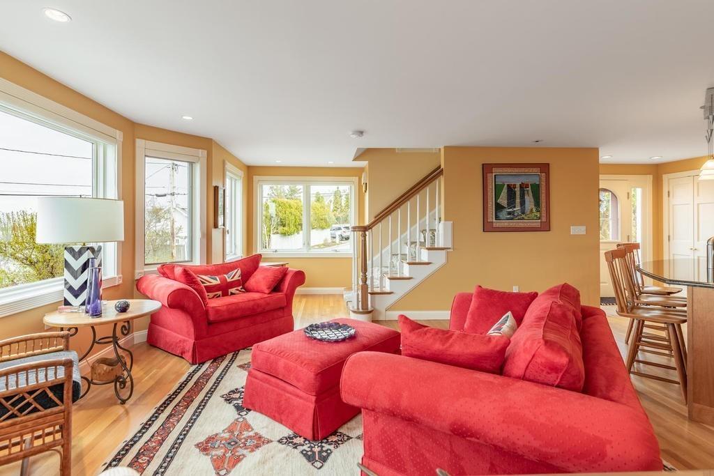 79 Clark Road Ipswich, MA 01938 - Photo 19 of 35 a living room with furniture and a floor to ceiling window