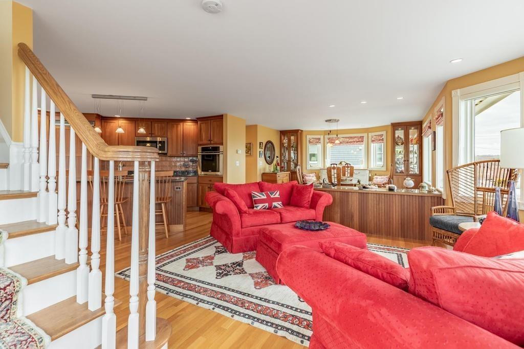 79 Clark Road Ipswich, MA 01938 - Photo 20 of 35 a living room with furniture kitchen view and a large window