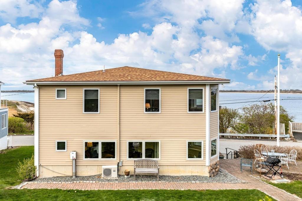 79 Clark Road Ipswich, MA 01938 - Photo 4 of 35 a front view of a house with a garden