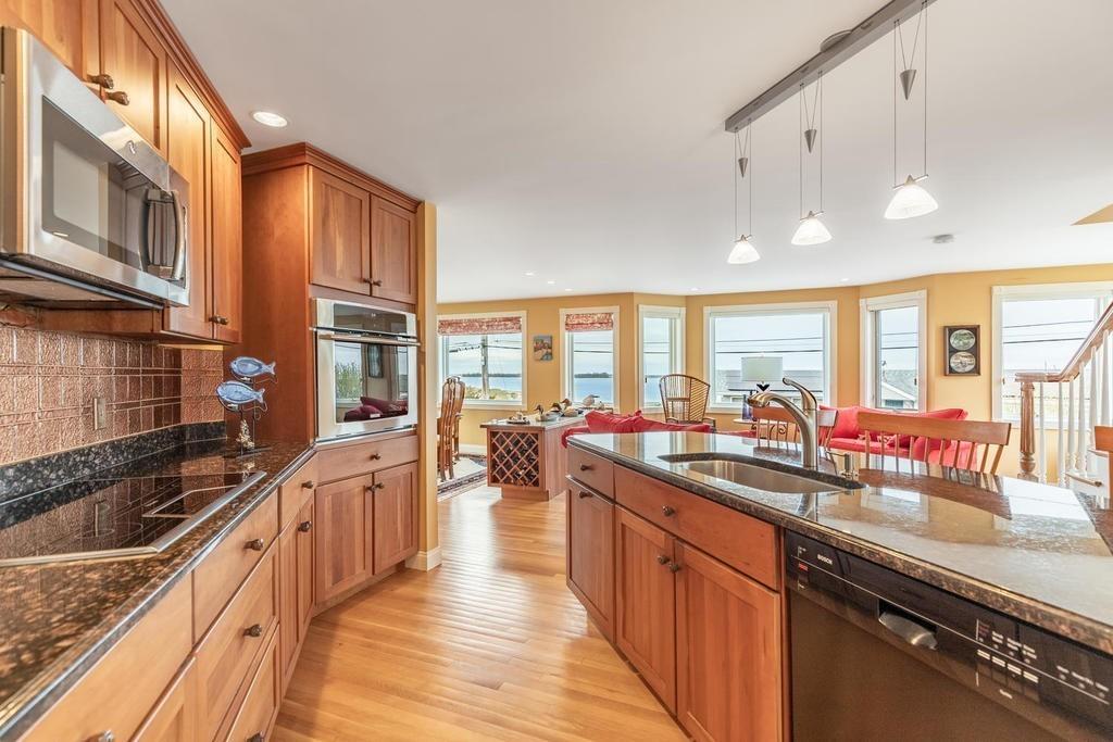 79 Clark Road Ipswich, MA 01938 - Photo 8 of 35 a kitchen with lots of counter top space a sink and appliances