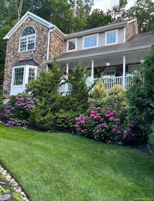 6 Sandy Hollow Road Centerport, NY 11768 - Photo 1 of 41 a front view of a house with a garden