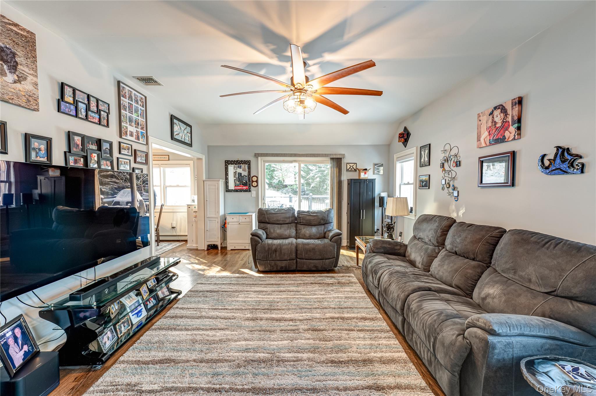 6 Sandy Hollow Road Centerport, NY 11768 - Photo 21 of 41 a living room with furniture a flat screen tv and a couch