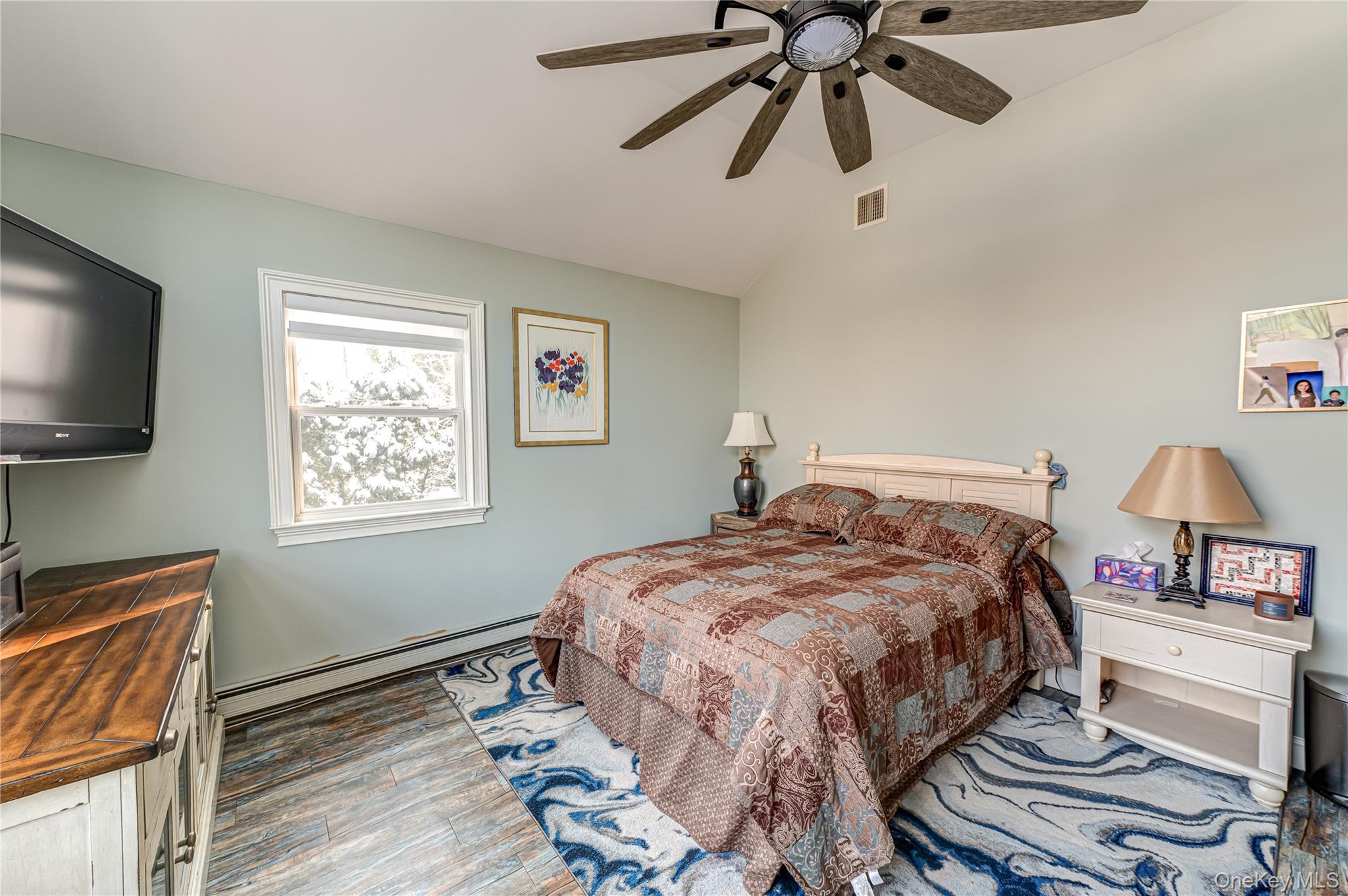 6 Sandy Hollow Road Centerport, NY 11768 - Photo 25 of 41 a bedroom with a bed and a flat screen tv