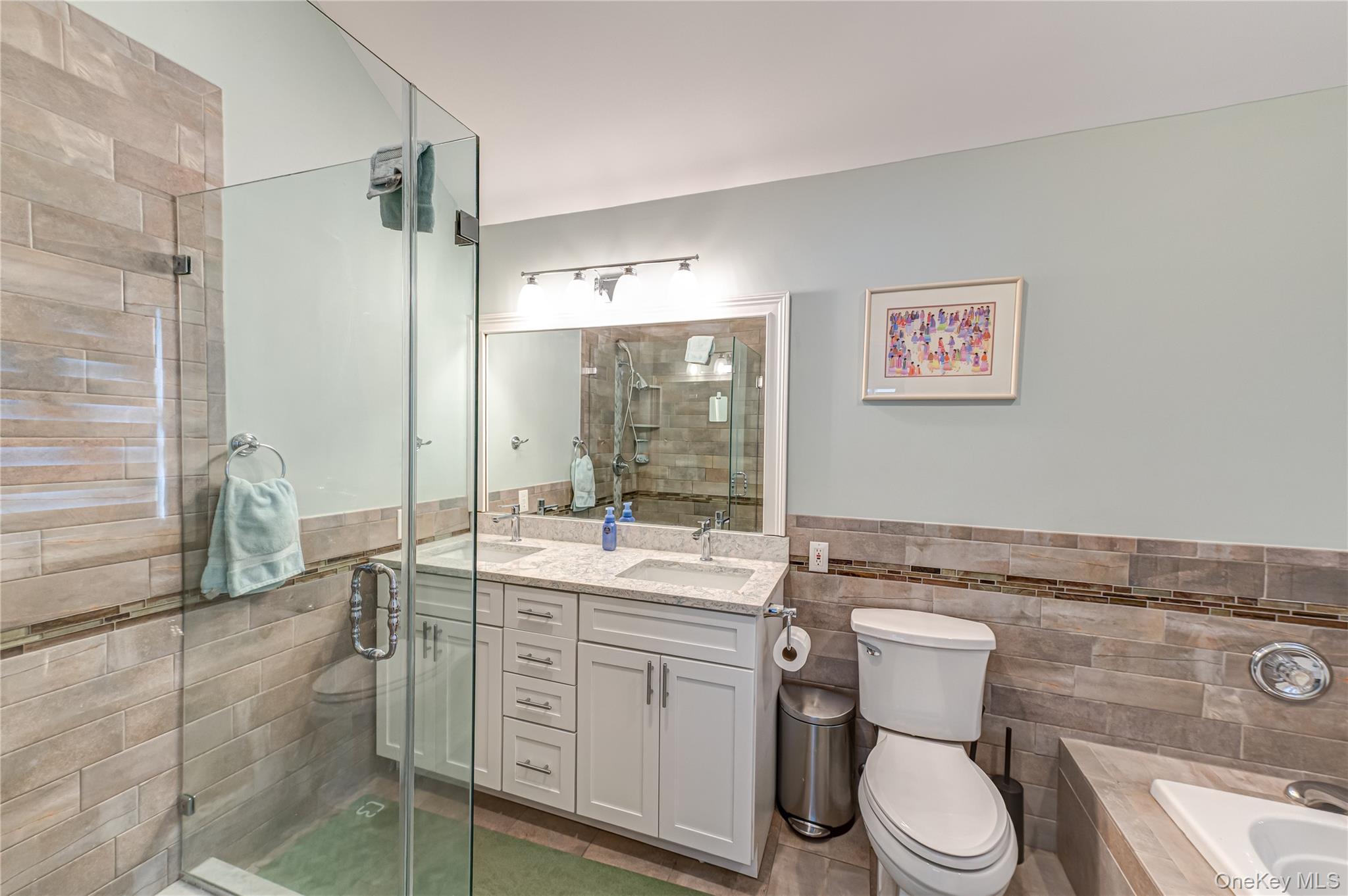 6 Sandy Hollow Road Centerport, NY 11768 - Photo 28 of 41 a bathroom with a granite countertop sink mirror vanity and toilet