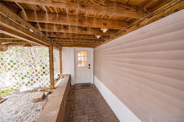 a view of balcony with wooden floor