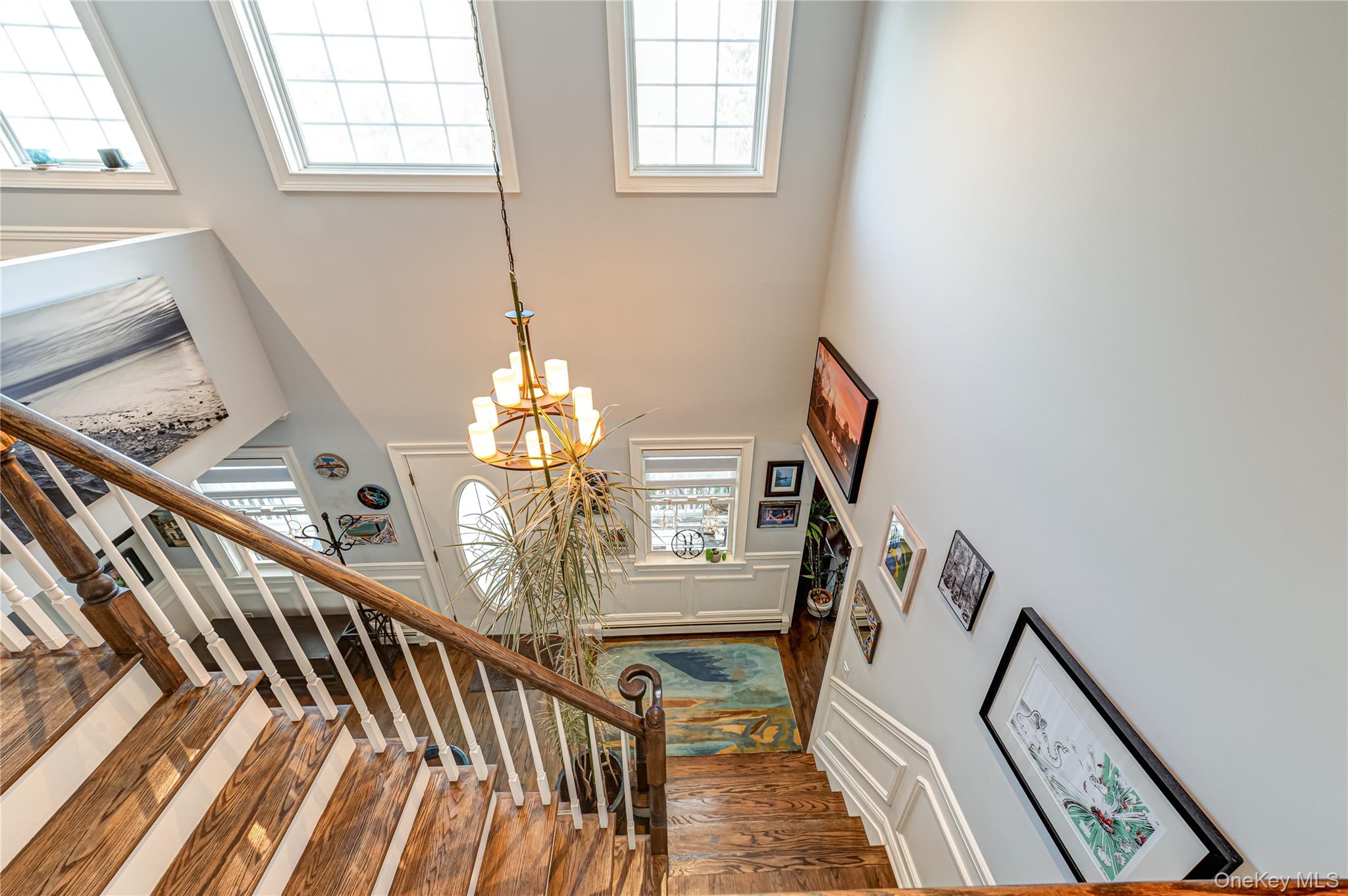 6 Sandy Hollow Road Centerport, NY 11768 - Photo 34 of 41 a view of an entryway wooden floor and chandelier