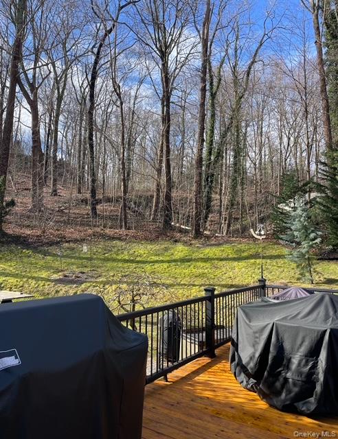 6 Sandy Hollow Road Centerport, NY 11768 - Photo 36 of 41 a view of a swimming pool with a patio and wooden floor