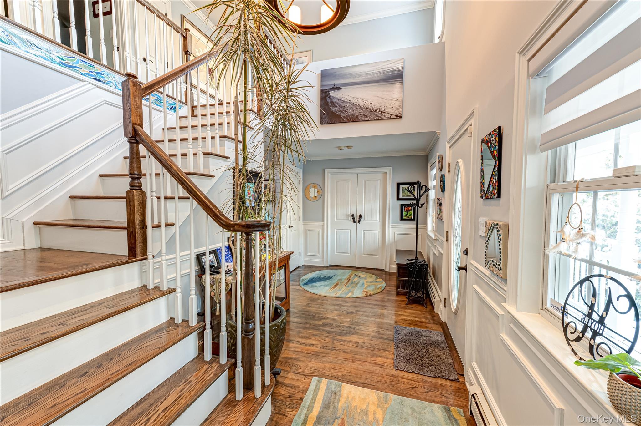 6 Sandy Hollow Road Centerport, NY 11768 - Photo 8 of 41 a view of an entryway with wooden floor and stairs