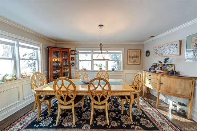 a view of a dining room with furniture window and outside view