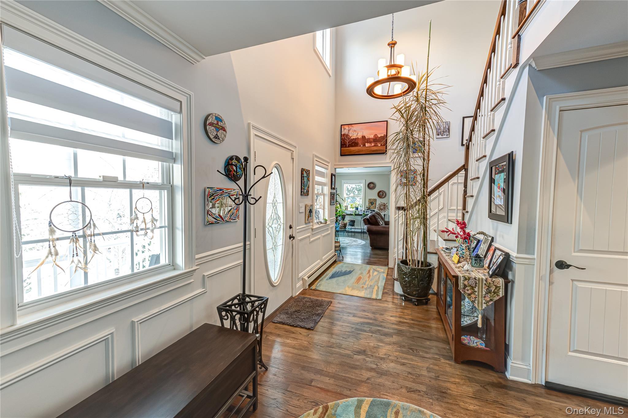 6 Sandy Hollow Road Centerport, NY 11768 - Photo 9 of 41 a view of a hallway with wooden floor and windows