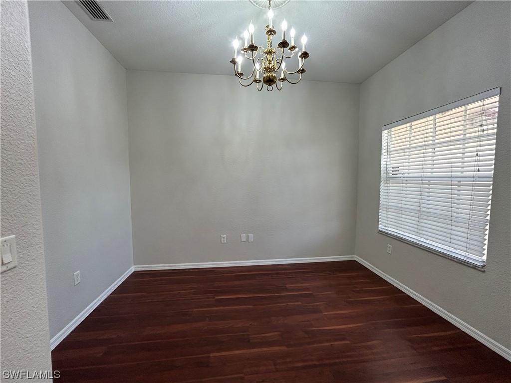 2562 Nature Pointe Loop Fort Myers, FL 33905 - Photo 13 of 44 a view of a room with wooden floor and window