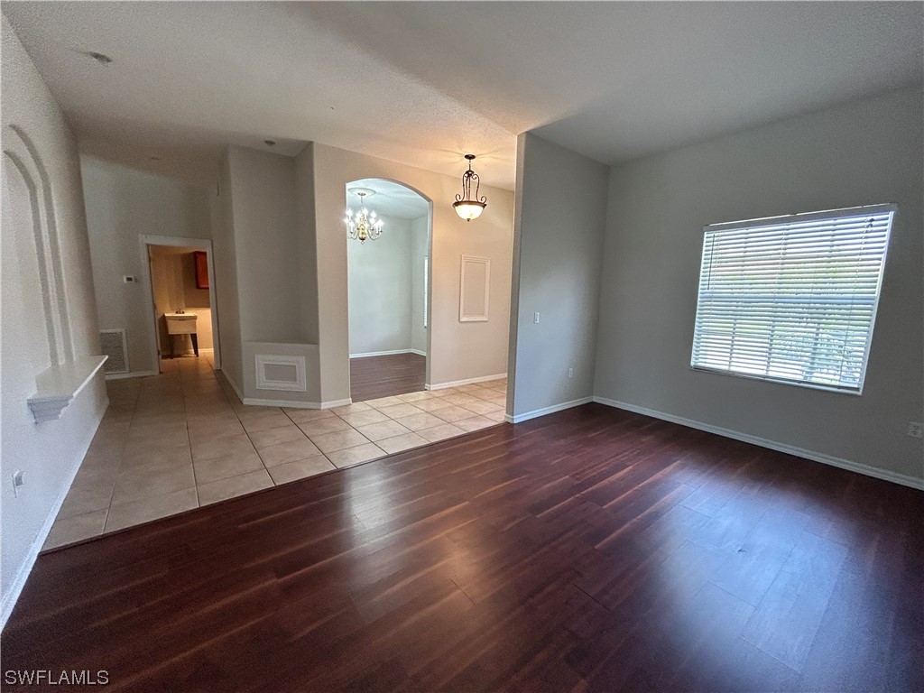 2562 Nature Pointe Loop Fort Myers, FL 33905 - Photo 15 of 44 wooden floor in an empty room with a window