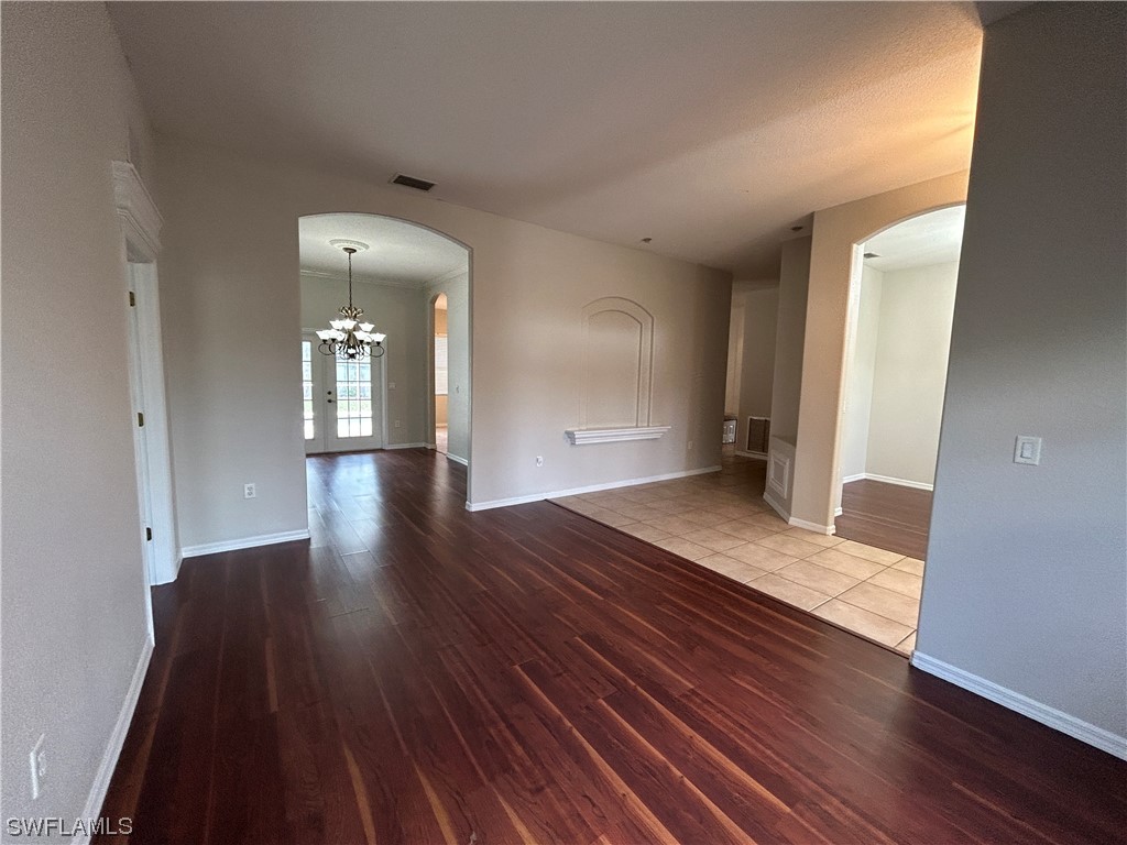 2562 Nature Pointe Loop Fort Myers, FL 33905 - Photo 16 of 44 wooden floor in an empty room with a window