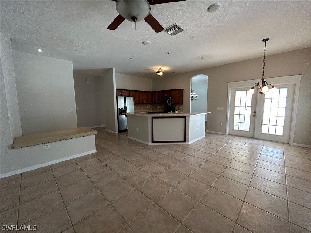 2562 Nature Pointe Loop Fort Myers, FL 33905 - Photo 17 of 44 a view of a big room with windows and fireplace